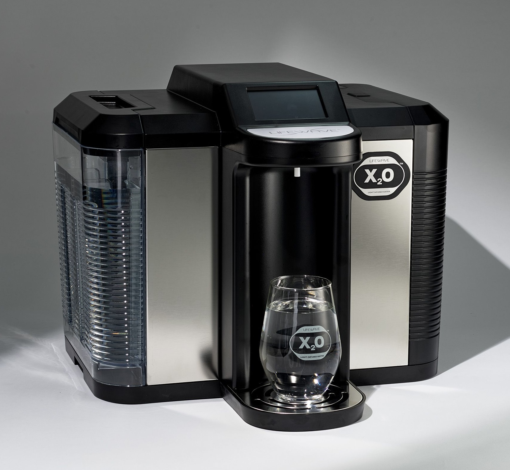 LifeWave X₂O water machine dispensing water into a glass